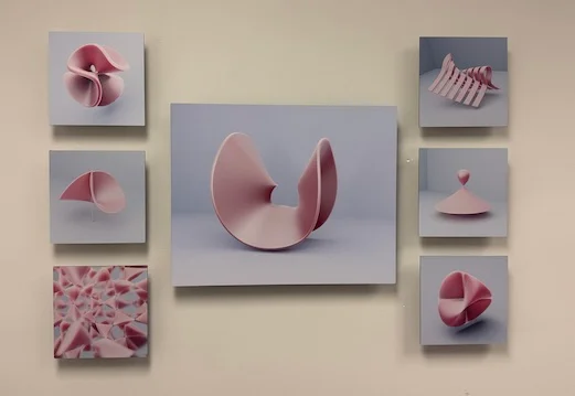 Singularity on the gallery wall: one large panel with six smaller ones around it, each a different singular surface.